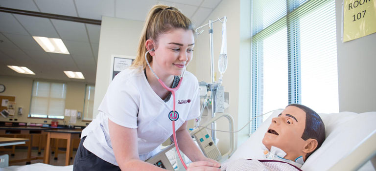 Nursing student working with 'patient'